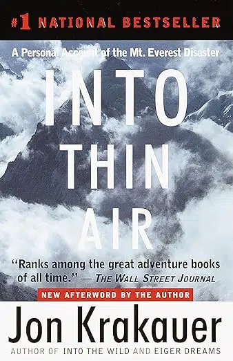 Book cover: #1 National Bestseller. A personal account of the Mt. Everest disaster. Into Thin Air by Jon Krakauer. Author of Into the Wild and Eiger Dreams. "Ranks among the great adventure books of all time." The Wall Street Journal. New afterword by the author. Photo of Mt. Everest surrounded by clouds.