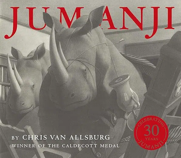 Book cover: Jumanji by Chris Van Allsburg. Pencil illustration of two rhinos in a house, furniture upturned. One rhino with a lamp cord looped around it's horn.