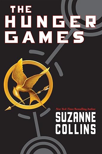 Cover of The Hunger Games by Suzanne Collins. Gold mockingjay pin.