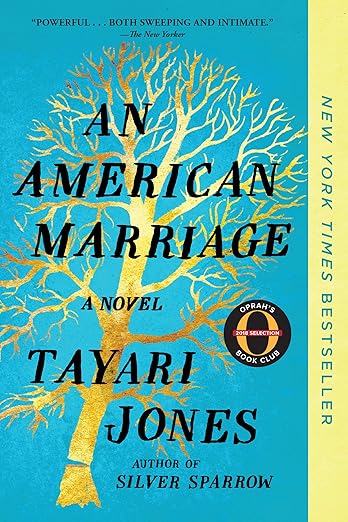 Book cover of “An American Marriage” by Tayari Jones. The artwork shows a golden tree with bare branches against a bright blue background. A vertical yellow band on the right reads “New York Times Bestseller,” and an Oprah’s Book Club badge appears near the center-right.