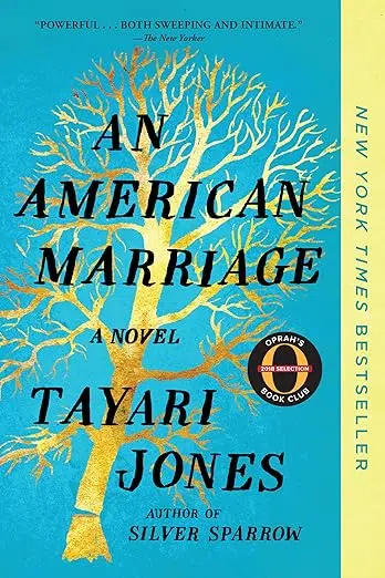 Book cover of “An American Marriage” by Tayari Jones. The artwork shows a golden tree with bare branches against a bright blue background. A vertical yellow band on the right reads “New York Times Bestseller,” and an Oprah’s Book Club badge appears near the center-right.