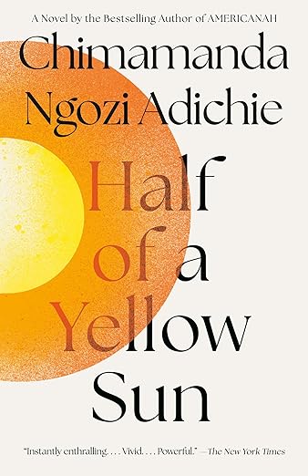 Book cover of “Half of a Yellow Sun” by Chimamanda Ngozi Adichie. The design features a large, textured yellow half-sun on the left side, fading from bright yellow to deep orange. The title text overlaps the sun against a light background.