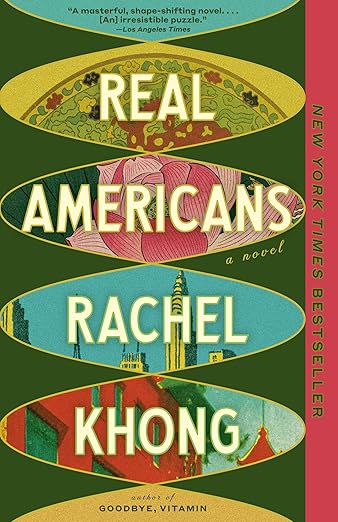 Book cover of “Real Americans” by Rachel Khong. The design features a vertical arrangement of oval windows against a dark green background, each showing a different stylized illustration—floral patterns, a pink lotus, a city skyline, and colorful buildings. A pink vertical band on the right reads “New York Times Bestseller.”
